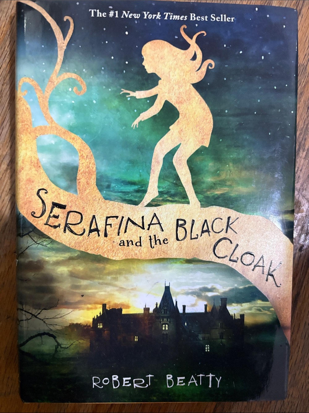 Serafina and the Black Cloak by Robert Beatty - Green & Gold Cover